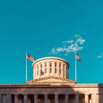 a building with two flags on top of it